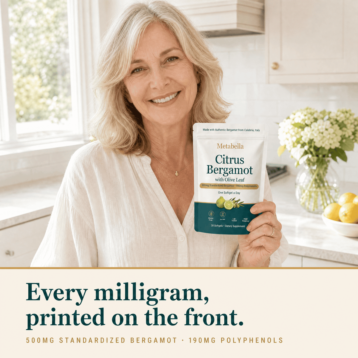 Woman in a kitchen holding Metabella Citrus Bergamot pouch: every milligram printed on the front